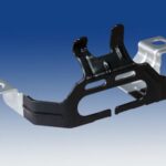 Silver and black small part blue bkgrd